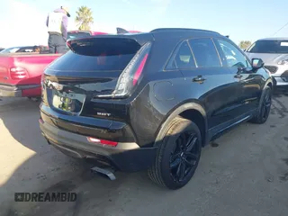 2019 Cadillac XT4 FWD Sport z VIN 1GYFZER43KF183181, wystawiony jako IAAI lot #41869141 z przebiegiem 25 539 mil mil oraz . Historia ofert i sprzedaży dostępna na DreamBid. Obrazek 4.