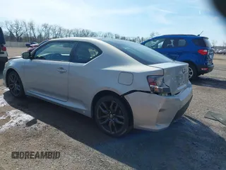 2014 Scion tC with VIN JTKJF5C70E3068144, listed as a IAAI auction lot 41983751 with 137,894 mi miles. Bid and sale history available at carsss.com. Image 3.