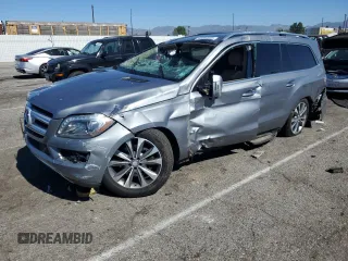 2014 Mercedes-Benz GL 450 z VIN 4JGDF7CE9EA326876, wystawiony jako Copart lot #46687055 z przebiegiem 122 818 mil mil oraz Szkody całkowita. Historia ofert i sprzedaży dostępna na DreamBid. Obrazek 1.