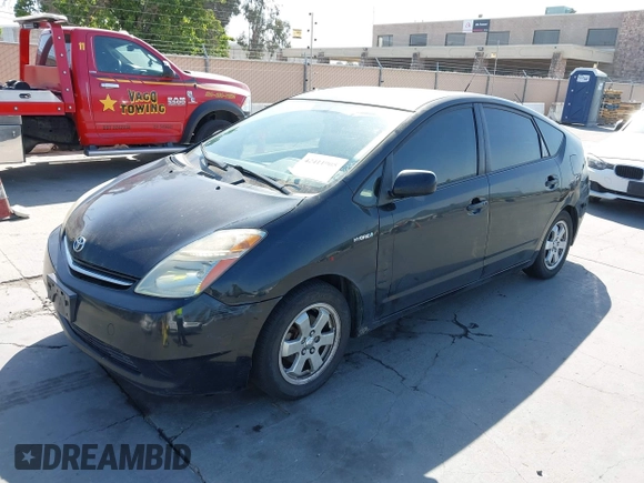 2007 Toyota Prius z VIN JTDKB20U977643711, wystawiony jako IAAI lot #42411905 z przebiegiem 112 362 mil mil oraz . Historia ofert i sprzedaży dostępna na DreamBid. Obrazek 2.