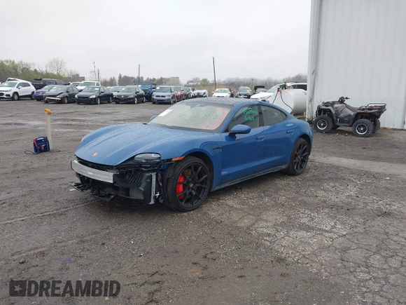 2022 Porsche Taycan GTS z VIN WP0AD2Y17NSA59692, wystawiony jako IAAI lot #41961572 z przebiegiem 12 680 mil mil oraz . Historia ofert i sprzedaży dostępna na DreamBid. Obrazek 2.