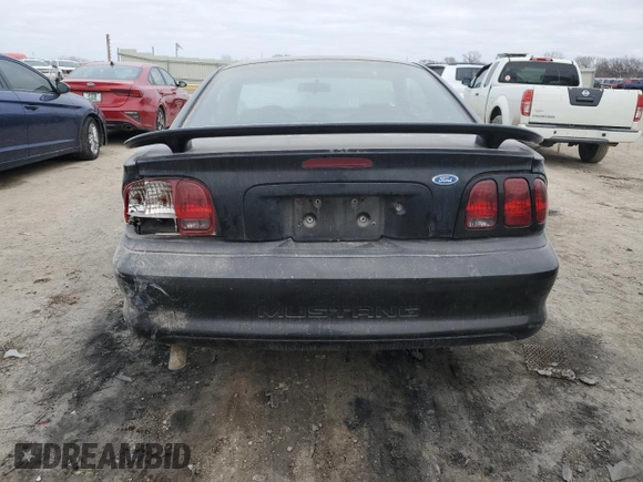 1997 Ford Mustang with VIN 1FALP4042VF198111, listed as a Copart auction lot 44245505 with 99,501 mi miles and Salvage Title. Bid and sale history available at carsss.com. Image 6.