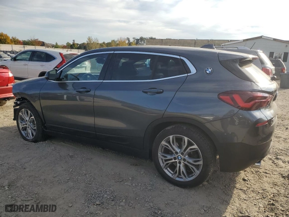 2021 BMW X2 xDrive28i with VIN WBXYJ1C07M5S21169, listed as a Copart auction lot 77829574 with 24,173 mi miles and Salvage Title. Bid and sale history available at carsss.com. Image 2.