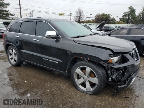 2015 Jeep Grand Cherokee Overland with VIN 1C4RJFCG7FC925995, listed as a Copart auction lot 85421214 with 142,266 mi miles and Salvage Title. Bid and sale history available at carsss.com. Image 4.