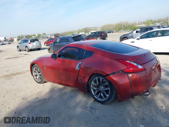 2014 Nissan 370Z Nismo with VIN JN1AZ4EH9EM636340, listed as a IAAI auction lot 42112548 with 143,894 mi miles and . Bid and sale history available at DreamBid. Image 3.