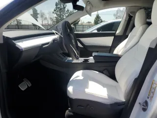 2022 Tesla Model Y Performance with VIN 7SAYGDEFXNF407340, listed as a Copart auction lot 54376895 with 56,709 mi miles and Salvage Title. Bid and sale history available at DreamBid. Image 7.