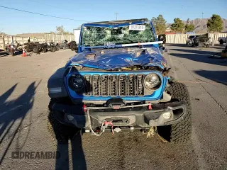 2024 Jeep Wrangler Rubicon z VIN 1C4PJXCG1RW298288, wystawiony jako Copart lot #81371914 z przebiegiem 4 445 mil mil oraz Szkoda całkowita • Salvage title. Historia ofert i sprzedaży dostępna na DreamBid. Obrazek 11.