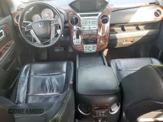2011 Honda Pilot Touring z VIN 5FNYF4H92BB090512, wystawiony jako Copart lot #57046015 z przebiegiem 159 814 mil mil oraz Szkoda całkowita • Salvage title. Historia ofert i sprzedaży dostępna na DreamBid. Obrazek 8.