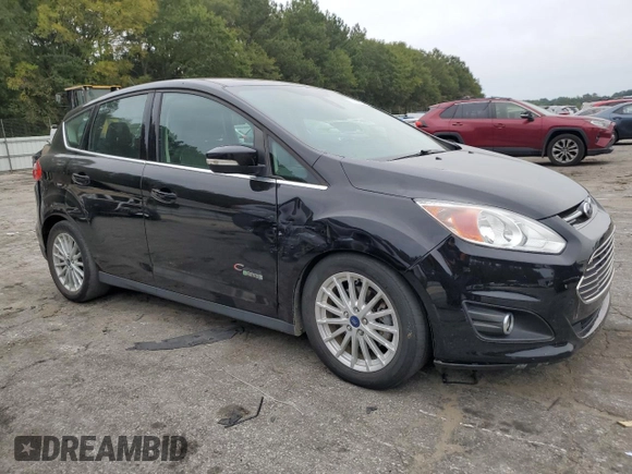 2016 Ford C-Max Energi SEL with VIN 1FADP5CU2GL112497, listed as a Copart auction lot 70890503 with 84,276 mi miles. Bid and sale history available at carsss.com. Image 4.