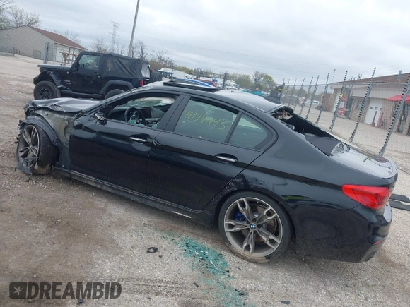 2018 BMW 5 Series M550i xDrive with VIN WBAJB9C56JB286742, listed as a IAAI auction lot 42176643 with 61,445 mi miles and . Bid and sale history available at DreamBid. Image 3.