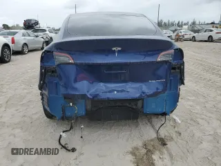 2023 Tesla Model Y Long Range z VIN 7SAYGDEE5PF787794, wystawiony jako Copart lot #55212605 z przebiegiem 30 277 mil mil oraz Szkoda całkowita • Salvage title. Historia ofert i sprzedaży dostępna na DreamBid. Obrazek 6.