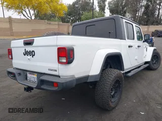 2020 Jeep Gladiator Sport S with VIN 1C6HJTAG9LL194454, listed as a IAAI auction lot 42430339 with 90,461 mi miles and . Bid and sale history available at DreamBid. Image 4.
