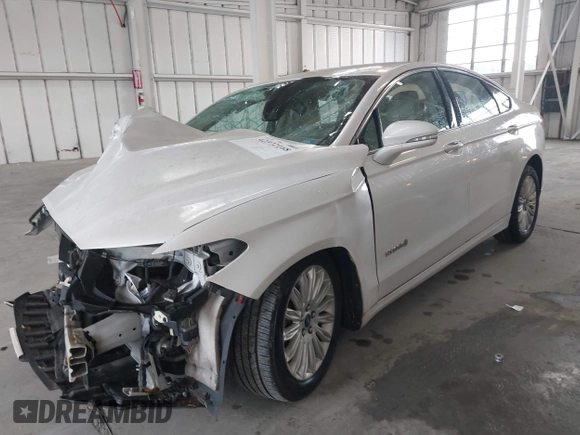 2013 Ford Fusion SE Hybrid with VIN 3FA6P0LU8DR357054, listed as a IAAI auction lot 42372168 with 143,979 mi miles and . Bid and sale history available at DreamBid. Image 2.