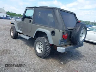 2004 Jeep Wrangler Sport with VIN 1J4FA49SX4P774167, listed as a IAAI auction lot 42686834 with 170,731 mi miles and . Bid and sale history available at DreamBid. Image 3.
