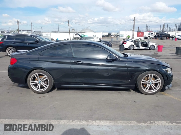2014 BMW 4 Series 428i with VIN WBA3N7C55EF719504, listed as a IAAI auction lot 41403957 with 98,882 mi miles and . Bid and sale history available at carsss.com. Image 13.