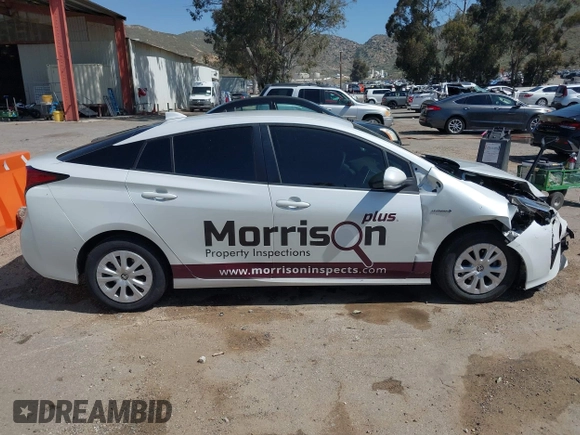 2021 Toyota Prius L Eco with VIN JTDKAMFU8M3133925, listed as a IAAI auction lot 41966660 with 115,193 mi miles. Bid and sale history available at carsss.com. Image 13.