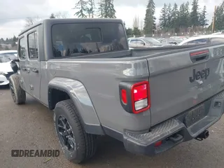 2021 Jeep Gladiator Willys with VIN 1C6HJTAG5ML616706, listed as a IAAI auction lot 41367142 with 50,951 mi miles and . Bid and sale history available at carsss.com. Image 3.