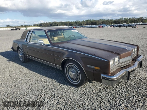 1985 Oldsmobile Toronado Custom Brougham z VIN 1G3EZ57Y6FE321802, wystawiony jako Copart lot #77305454 z przebiegiem 51 559 mil mil oraz Szkoda całkowita • Salvage title. Historia ofert i sprzedaży dostępna na DreamBid. Obrazek 4.
