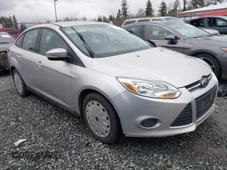 2013 Ford Focus SE z VIN 1FADP3F24DL227368, wystawiony jako IAAI lot #40966331 z przebiegiem 125 721 mil mil oraz . Historia ofert i sprzedaży dostępna na DreamBid. Obrazek 1.
