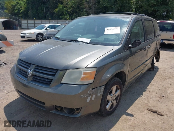 2010 Dodge Grand Caravan SE with VIN 2D4RN4DE6AR339734, listed as a IAAI auction lot 40086879 with 221,062 mi miles and . Bid and sale history available at DreamBid. Image 2.