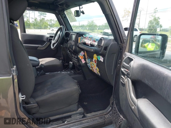 2016 Jeep Wrangler Black Bear with VIN 1C4AJWAGXGL258874, listed as a IAAI auction lot 42497153 with 93,294 mi miles and . Bid and sale history available at DreamBid. Image 5.