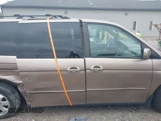 2003 Honda Odyssey EX-L z VIN 5FNRL18973B122173, wystawiony jako IAAI lot #42252018 z przebiegiem 204 487 mil mil oraz . Historia ofert i sprzedaży dostępna na DreamBid. Obrazek 14.