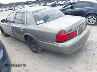 1999 Mercury Grand Marquis GS z VIN 2MEFM74W4XX631219, wystawiony jako IAAI lot #42096304 z przebiegiem 267 738 mil mil oraz . Historia ofert i sprzedaży dostępna na DreamBid. Obrazek 3.