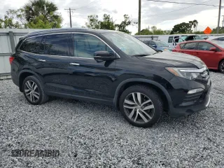 2017 Honda Pilot Touring with VIN 5FNYF6H9XHB075468, listed as a Copart auction lot 50012215 with 90,718 mi miles and Salvage Title. Bid and sale history available at carsss.com. Image 4.