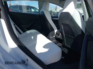 2023 Tesla Model 3 with VIN 5YJ3E1EA6PF495631, listed as a IAAI auction lot 41568118 with 10,073 mi miles and . Bid and sale history available at DreamBid. Image 8.