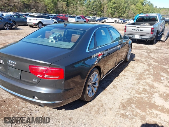 2011 Audi A8 with VIN WAURVAFDXBN014290, listed as a IAAI auction lot 40860777 with 152,584 mi miles and . Bid and sale history available at DreamBid. Image 4.
