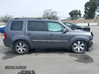 2015 Honda Pilot Touring with VIN 5FNYF3H91FB011847, listed as a IAAI auction lot 41841293 with 99,431 mi miles. Bid and sale history available at carsss.com. Image 14.