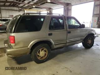 2000 Chevrolet Blazer LT z VIN 1GNDT13W1Y2282557, wystawiony jako Copart lot #55560775 z przebiegiem 219 795 mil mil oraz Szkoda całkowita • Salvage title. Historia ofert i sprzedaży dostępna na DreamBid. Obrazek 3.