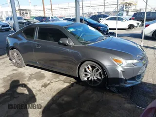 2016 Scion tC with VIN JTKJF5C78GJ014184, listed as a IAAI auction lot 41622575 with 128,520 mi miles. Bid and sale history available at carsss.com. Image 1.
