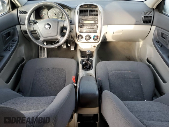 2005 Kia Spectra with VIN KNAFE161655093051, listed as a Copart auction lot 77821904 with 104,874 mi miles and Salvage Title. Bid and sale history available at carsss.com. Image 8.