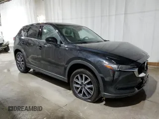 2018 Mazda CX-5 Grand Touring with VIN JM3KFBDM1J0440947, listed as a Copart auction lot 48579825 with 63,164 mi miles and Non Repairable. Bid and sale history available at carsss.com. Image 4.