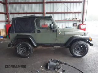 2005 Jeep Wrangler X z VIN 1J4FA39S75P310037, wystawiony jako IAAI lot #42186114 z przebiegiem 154 462 mil mil oraz . Historia ofert i sprzedaży dostępna na DreamBid. Obrazek 13.