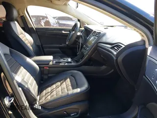 2018 Ford Fusion SE z VIN 3FA6P0H77JR180057, wystawiony jako IAAI lot #41729451 z przebiegiem 122 200 mil mil oraz . Historia ofert i sprzedaży dostępna na DreamBid. Obrazek 5.