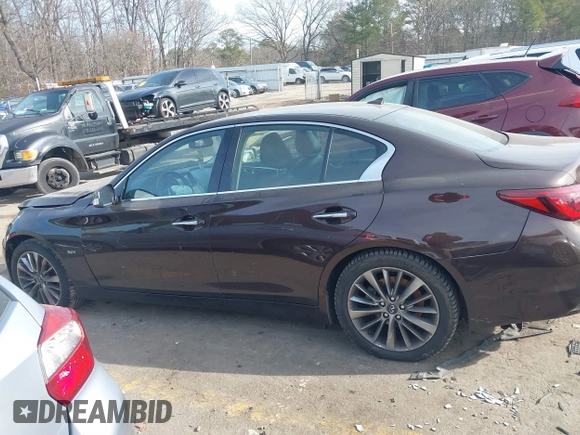 2019 Infiniti Q50 3.0t LUXE with VIN JN1EV7AP9KM512446, listed as a IAAI auction lot 41311730 with 105,000 mi miles. Bid and sale history available at carsss.com. Image 13.