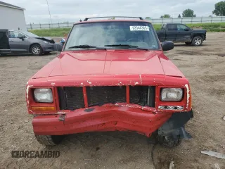 1999 Jeep Cherokee Sport with VIN 1J4FF68S4XL580048, listed as a Copart auction lot 62546365 with 154,059 mi miles and Clean title. Bid and sale history available at DreamBid. Image 5.