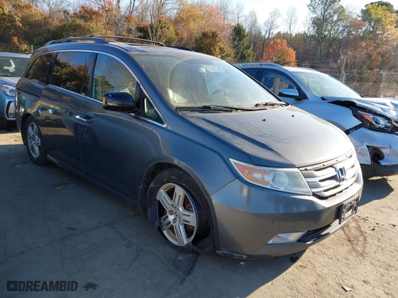 2013 Honda Odyssey Touring with VIN 5FNRL5H9XDB009973, listed as a IAAI auction lot 41904710 with 219,067 mi miles. Bid and sale history available at carsss.com. Image 1.