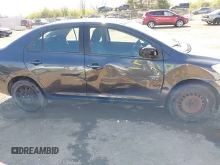 2009 Toyota Yaris with VIN JTDBT903194047784, listed as a IAAI auction lot 42049872 with 115,735 mi miles. Bid and sale history available at carsss.com. Image 6.