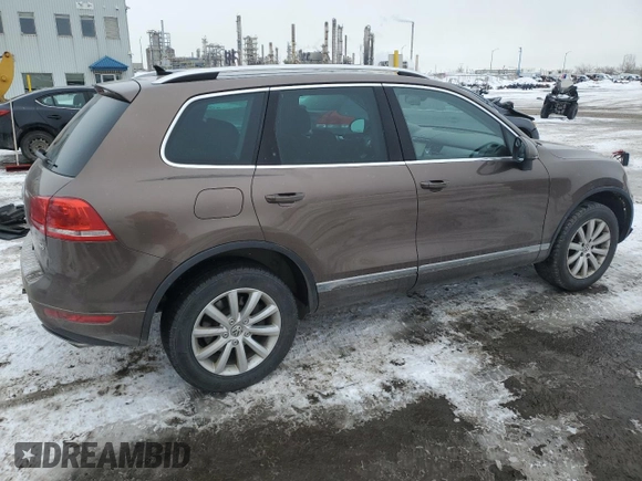 2012 Volkswagen Touareg Sport z VIN WVGEF9BP8CD006057, wystawiony jako Copart lot #47739265 z przebiegiem 213 580 mil mil oraz Szkoda całkowita • Salvage title. Historia ofert i sprzedaży dostępna na DreamBid. Obrazek 3.