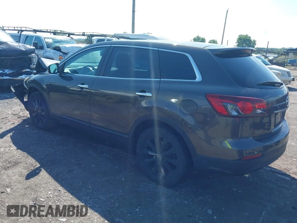 2015 Mazda CX-9 Grand Touring z VIN JM3TB3DV8F0465155, wystawiony jako IAAI lot #42366636 z przebiegiem 125 407 mil mil oraz . Historia ofert i sprzedaży dostępna na DreamBid. Obrazek 3.