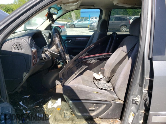 2005 GMC Envoy SLT z VIN 1GKET16M356134877, wystawiony jako Copart lot #57333345 z przebiegiem 205 714 mil mil oraz Szkoda całkowita • Salvage title. Historia ofert i sprzedaży dostępna na DreamBid. Obrazek 7.