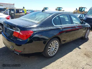 2012 BMW 7 Series 750i with VIN WBAKA8C50CCY37892, listed as a IAAI auction lot 42080313 with 148,058 mi miles. Bid and sale history available at carsss.com. Image 4.