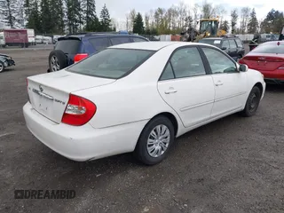 2004 Toyota Camry LE with VIN JTDBE32K840256161, listed as a IAAI auction lot 42000050 with 367,016 mi miles. Bid and sale history available at carsss.com. Image 4.