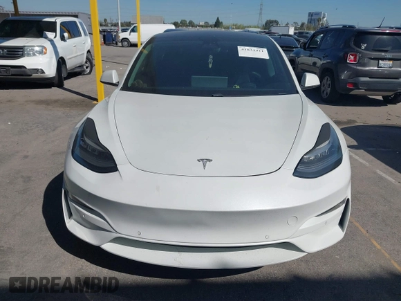 2020 Tesla Model 3 Standard Range Plus with VIN 5YJ3E1EA1LF659765, listed as a IAAI auction lot 41834411 with 42,433 mi miles and . Bid and sale history available at carsss.com. Image 12.
