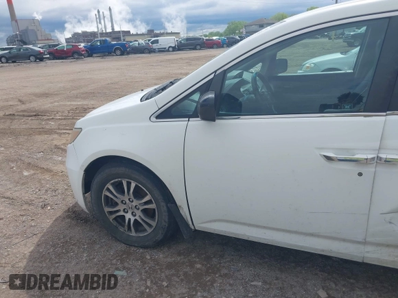 2012 Honda Odyssey EX-L with VIN 5FNRL5H63CB117341, listed as a IAAI auction lot 42197815 with 256,544 mi miles and . Bid and sale history available at DreamBid. Image 14.