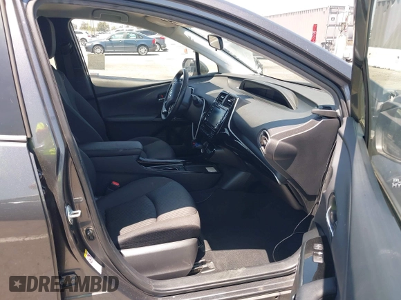 2021 Toyota Prius LE with VIN JTDKAMFPXM3170372, listed as a IAAI auction lot 42661609 with 47,977 mi miles and . Bid and sale history available at DreamBid. Image 5.