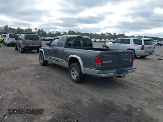 2003 Dodge Dakota SLT with VIN 1D7HL42N63S100130, listed as a IAAI auction lot 41419945 with 185,326 mi miles. Bid and sale history available at carsss.com. Image 3.